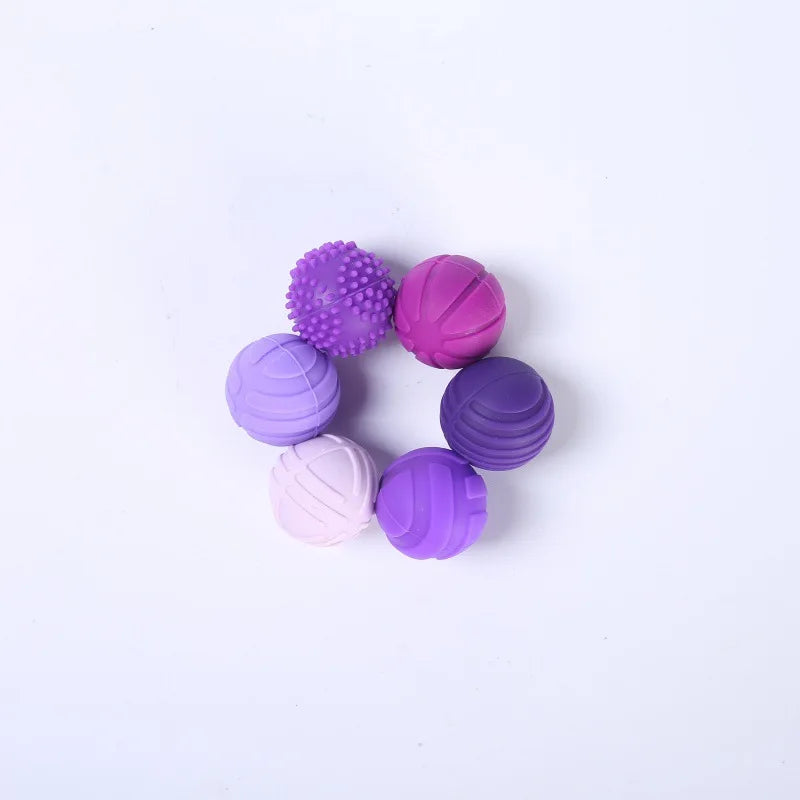 Juguete sensorial con forma de bolas de silicona moradas | Neuromart