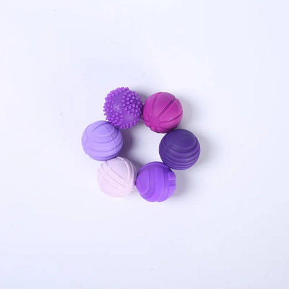 Juguete sensorial con forma de bolas de silicona moradas | Neuromart