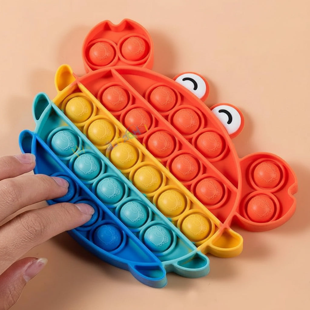 Juguete sensorial pop-it arcoíris - detalle burbujas | Neuromart