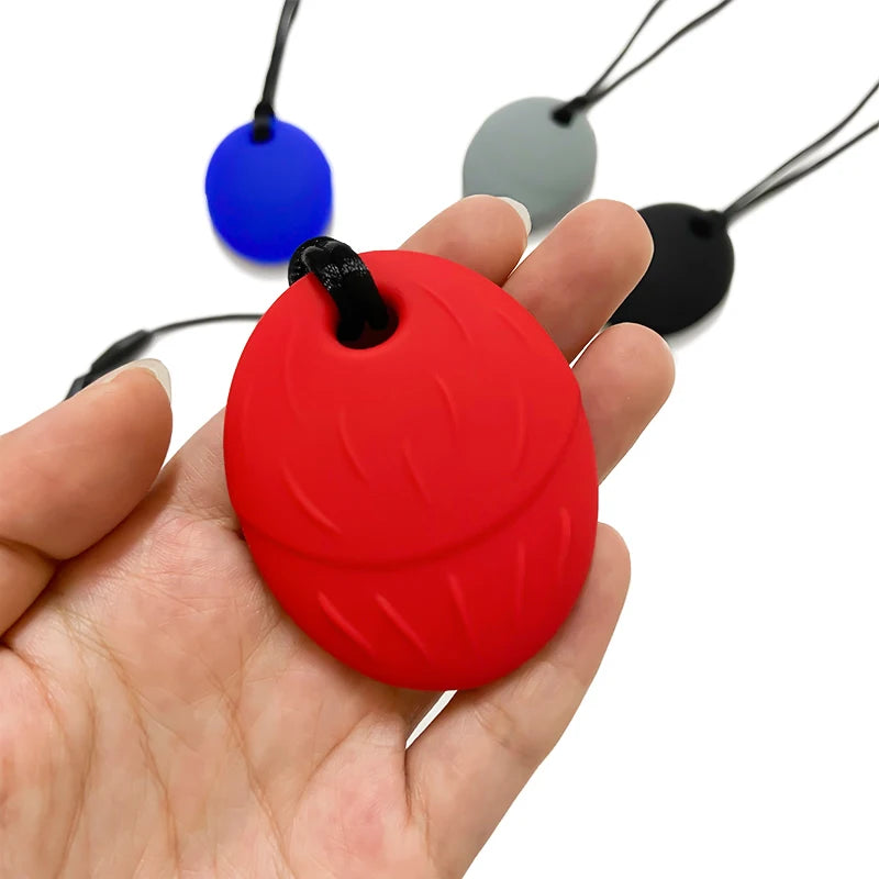 Colgante mordedor redondo - cordón ajustable | Neuromart